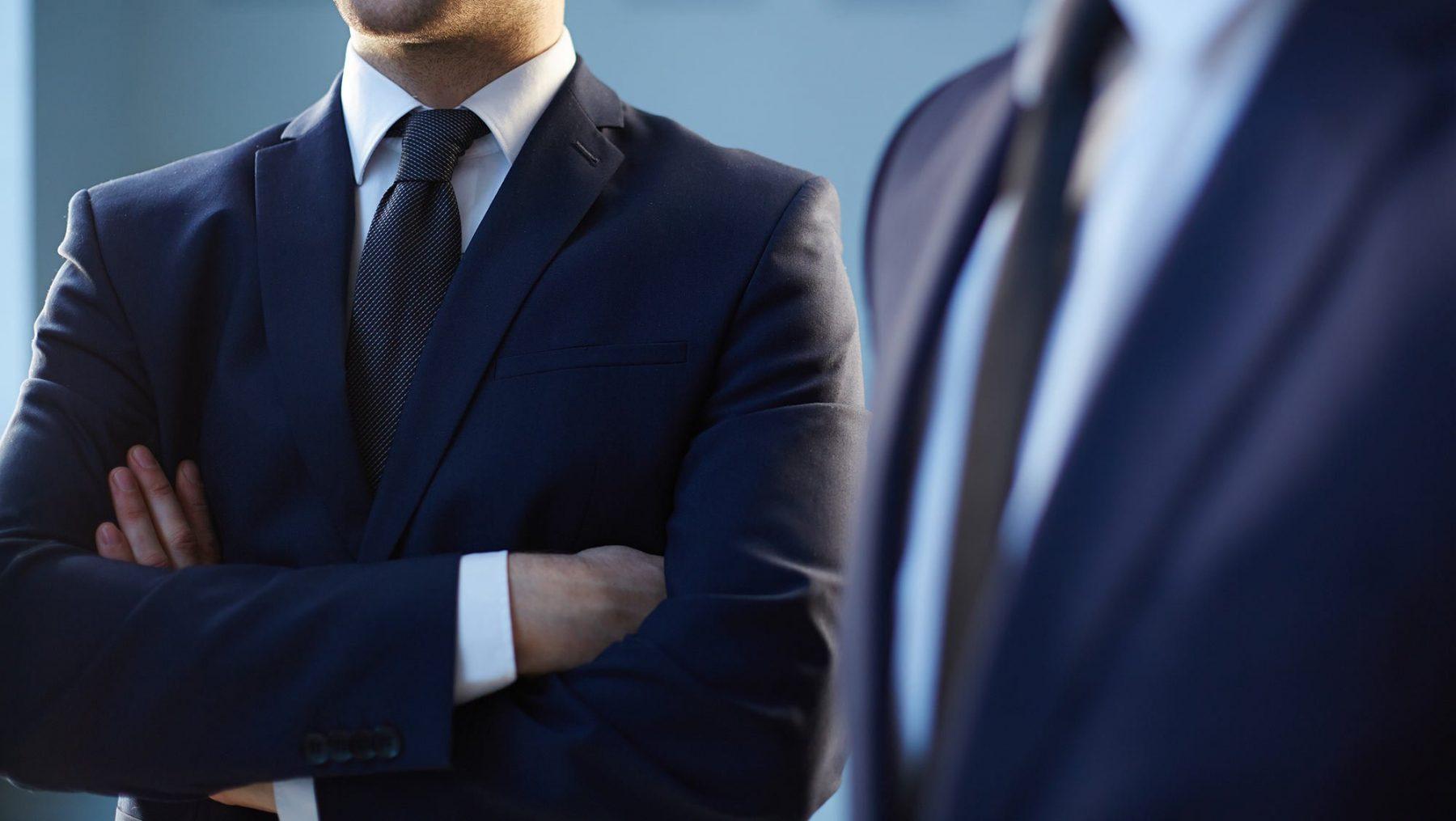 Businessman holding hands crossed