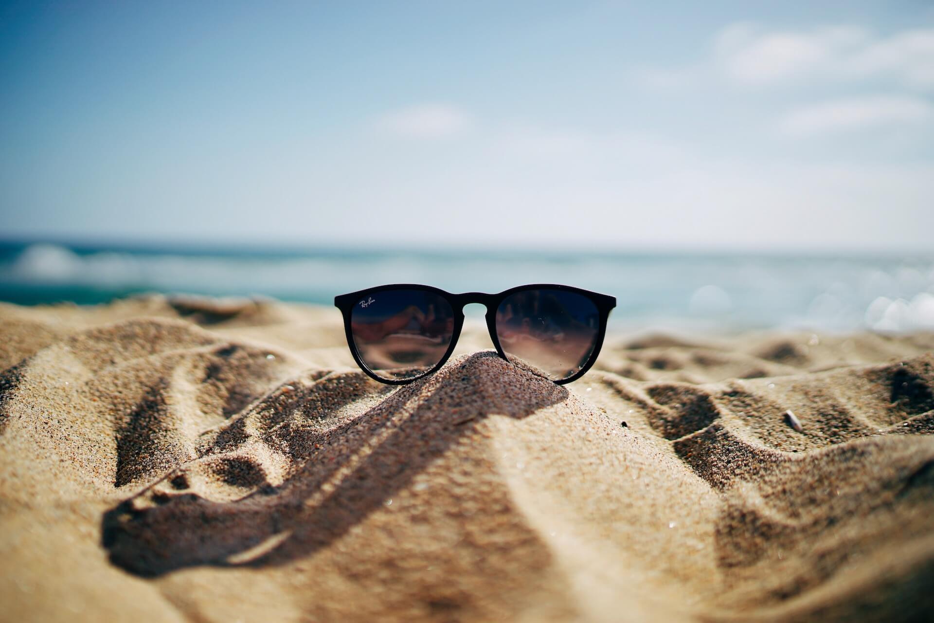 Sunglasses on sand