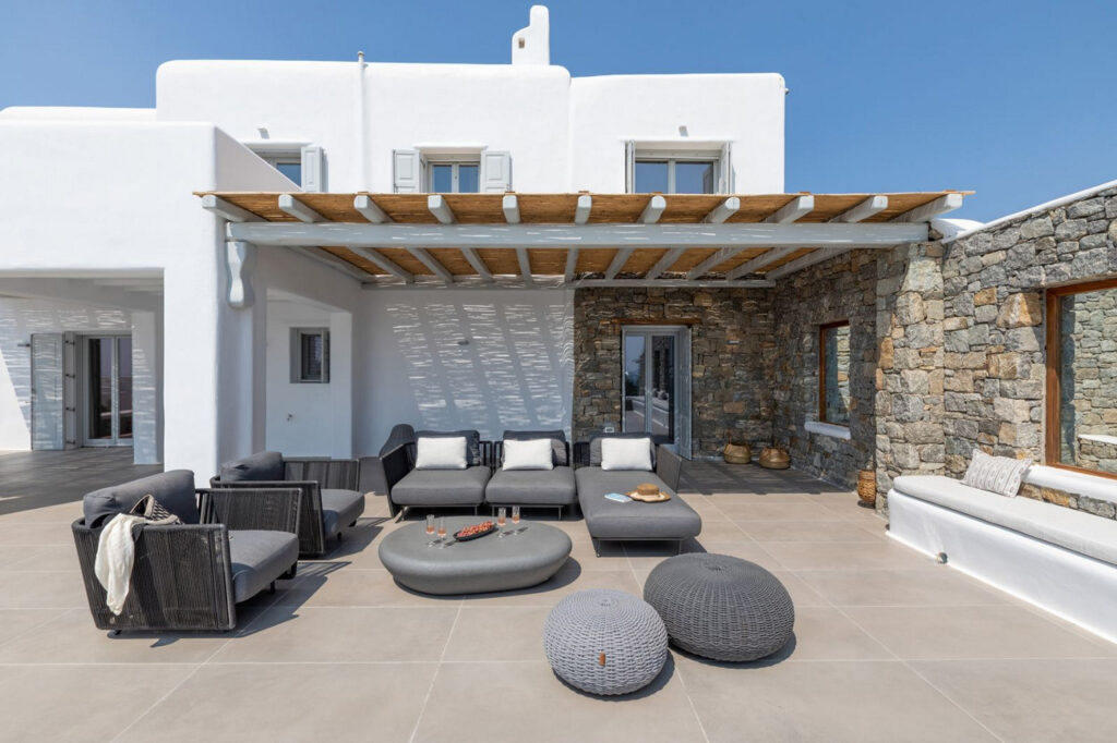 Chill-out area outside of lavish Mykonos private home for rent.