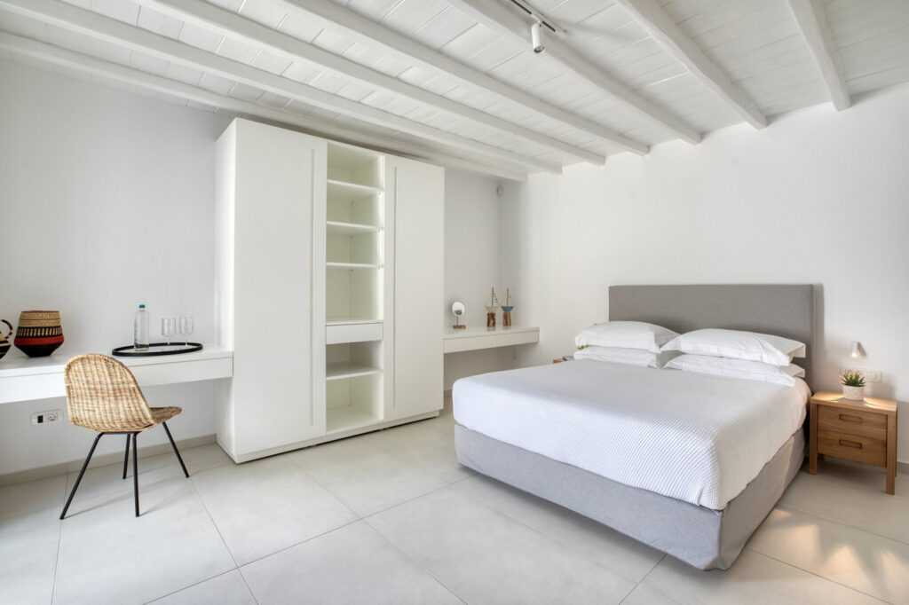 White spacious bedroom in Mykonos finest villa for rent.
