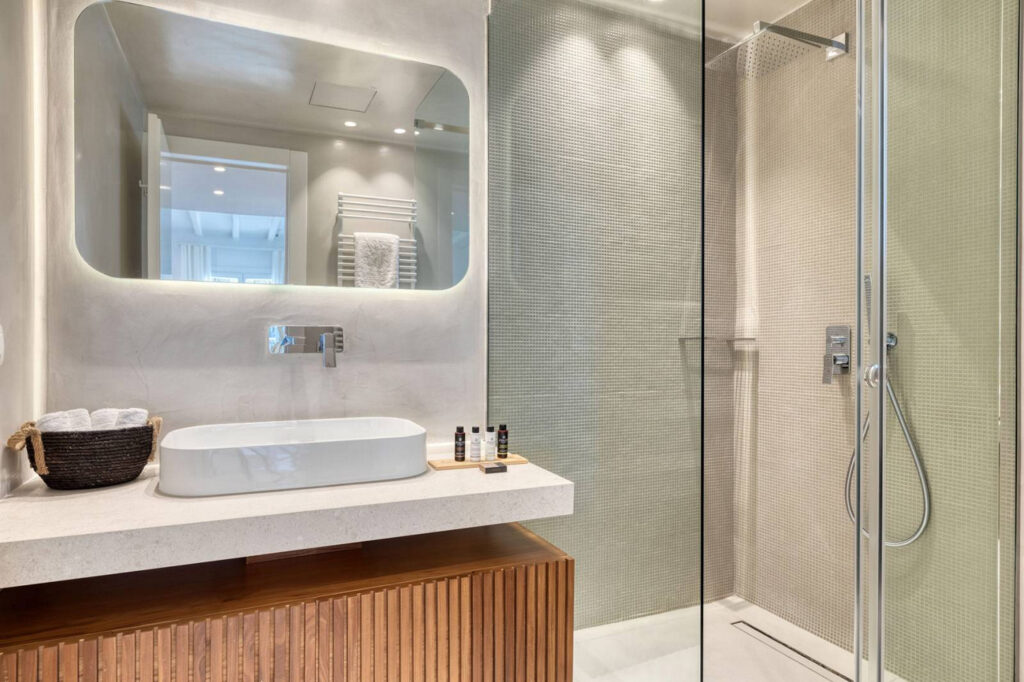 Modern shower and fancy details in a luxurious bathroom of Mykonos best villa for rent.