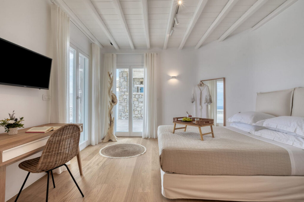 White and creamy bedroom in Mykonos splendid villa for rent.