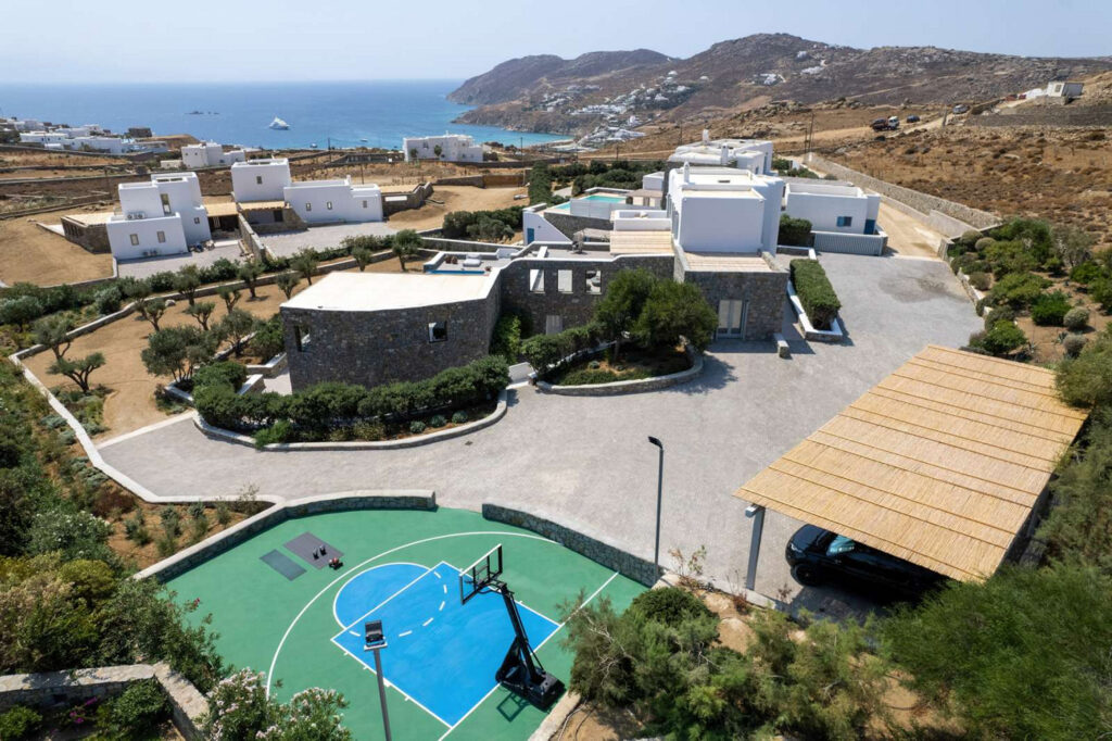 Basketball court, parking, and luxurious Mykonos villa for rent.