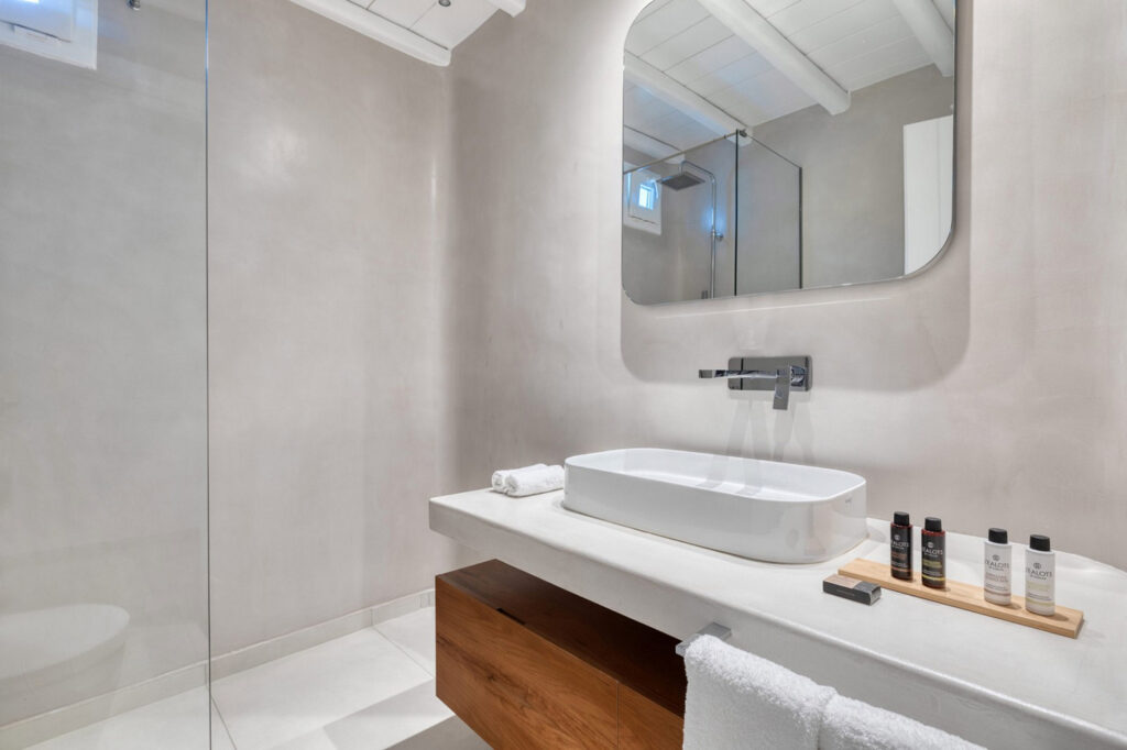 Sophisticated bathroom and its amenities in Mykonos lavish villa for rent.