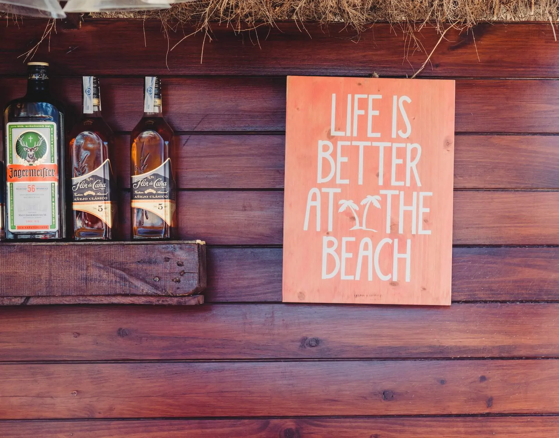 Wooden sign and drinks on a shelf