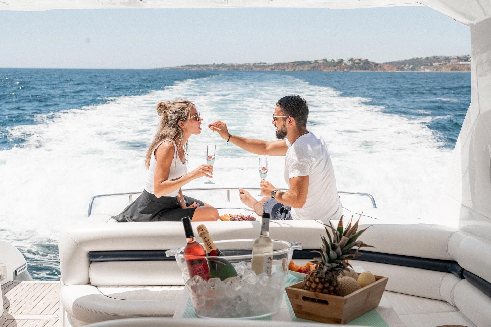 Couple celebrating on a yacht