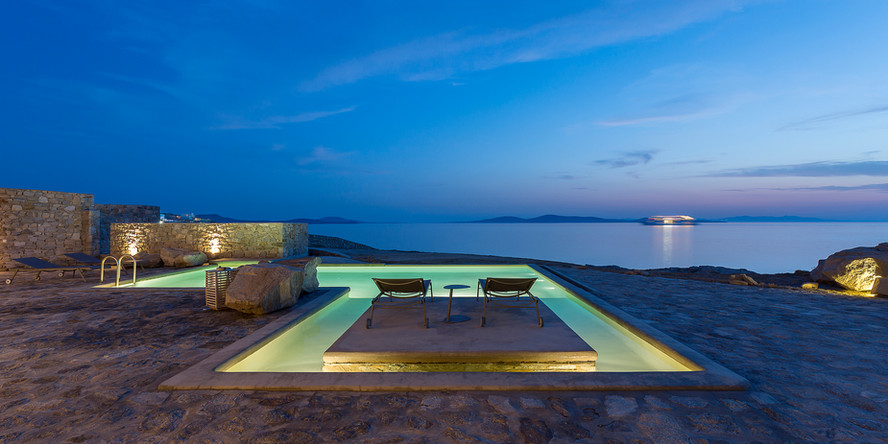 A grand and opulent villa located in the heart of Mykonos, offering panoramic views of the island and the sea. The villa boasts a private pool and terrace, perfect for soaking up the Mykonos sunshine and taking in the picturesque surroundings. The villa also offers concierge services to ensure that your stay is as comfortable and enjoyable as possible.