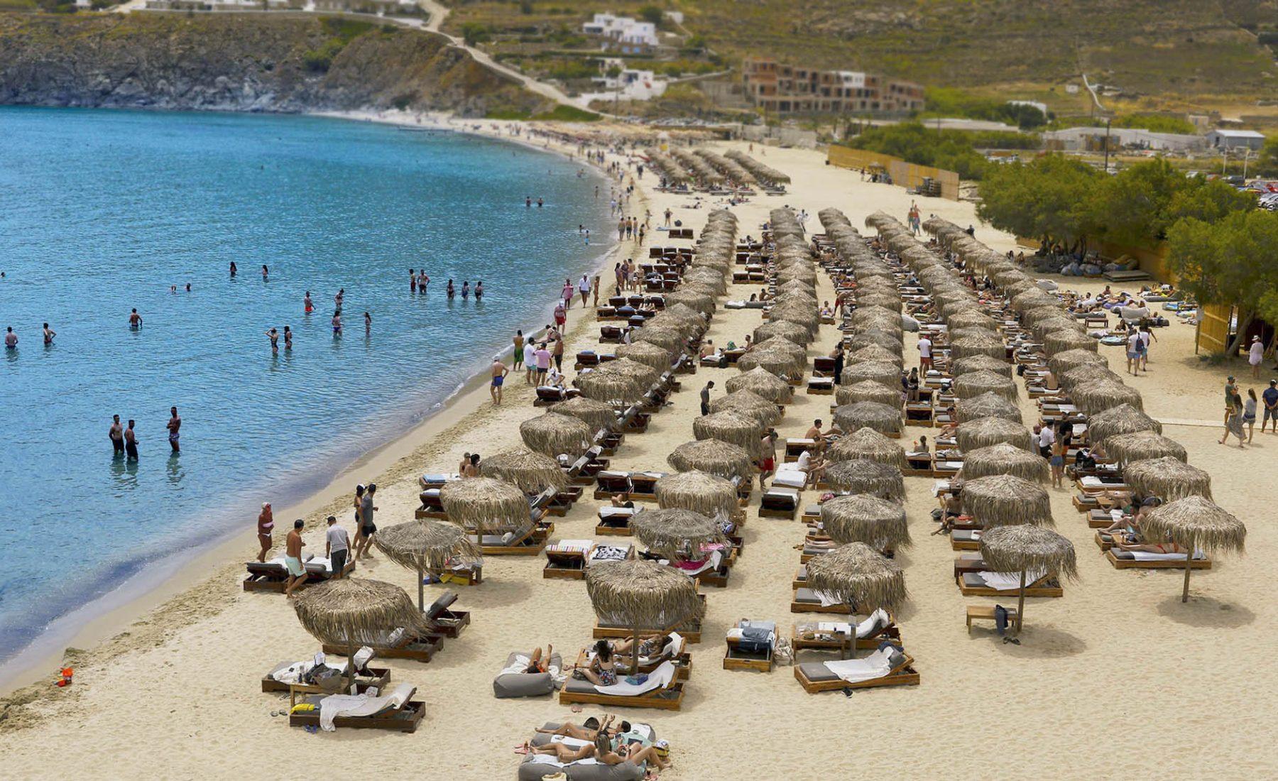 Sunbeds and umbrellas on the beach on Mykonos