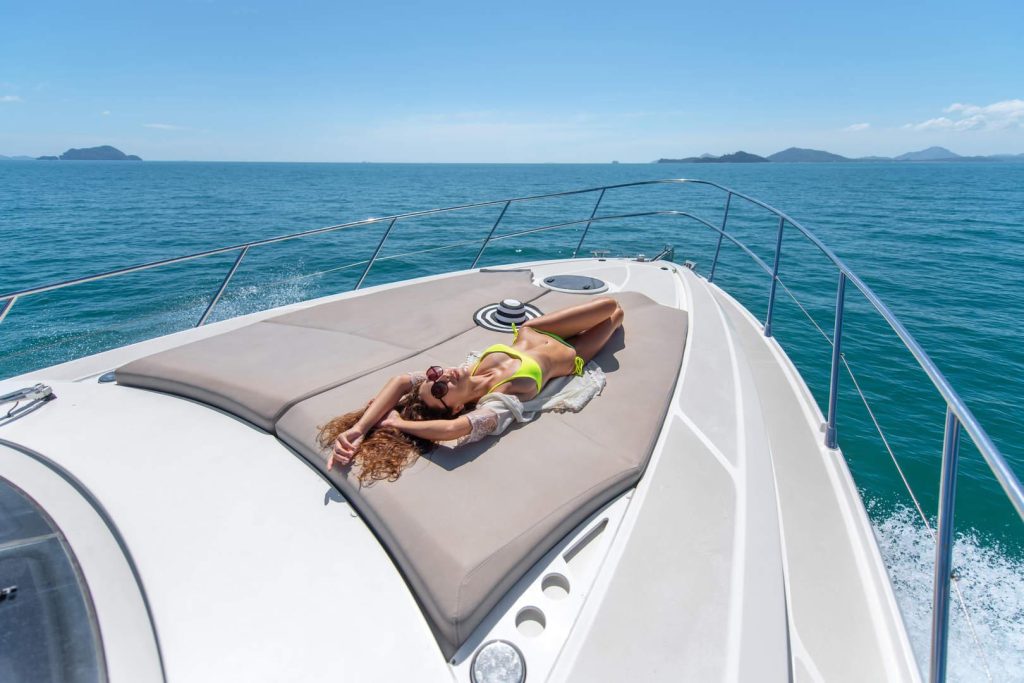 luxury vacation young beautiful female model lying sunbuthing deck yacht sea