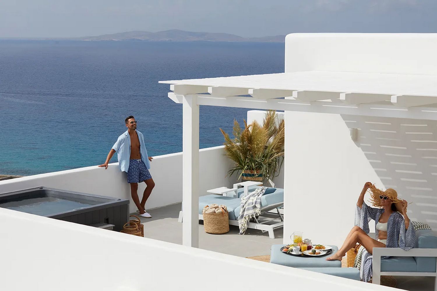 Couple enjoying the sun on the terrace in Villa Binoche on Mykonos