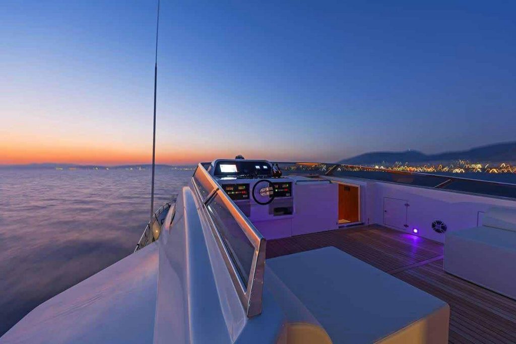 Yacht near the coast of Mykonos at sunset