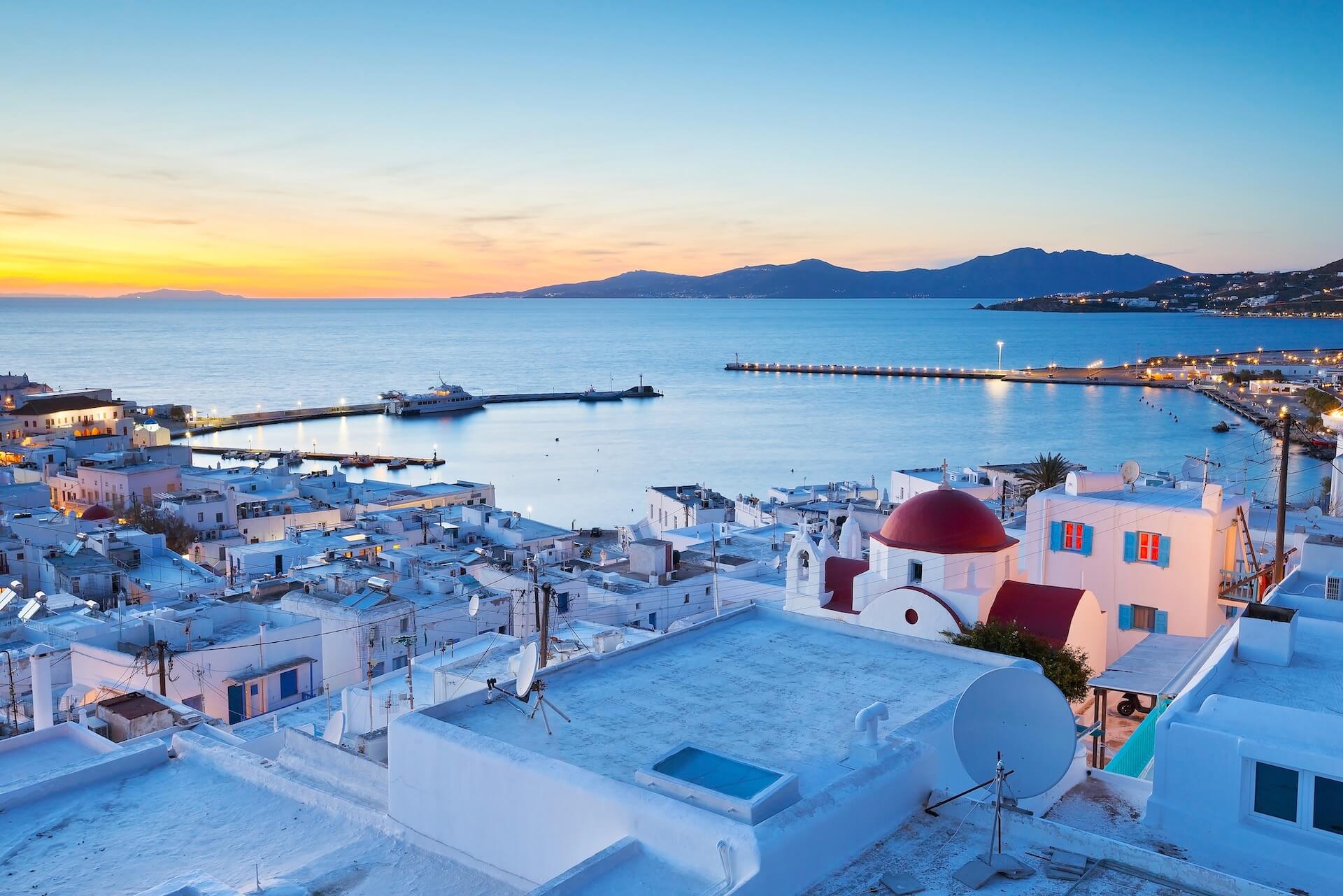 The view of the port and town in Mykonos at twilight