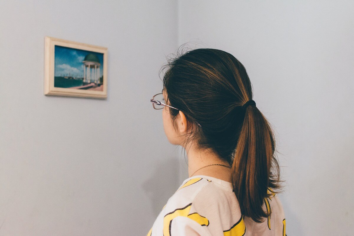 Girl admiring the artwork in a museum
