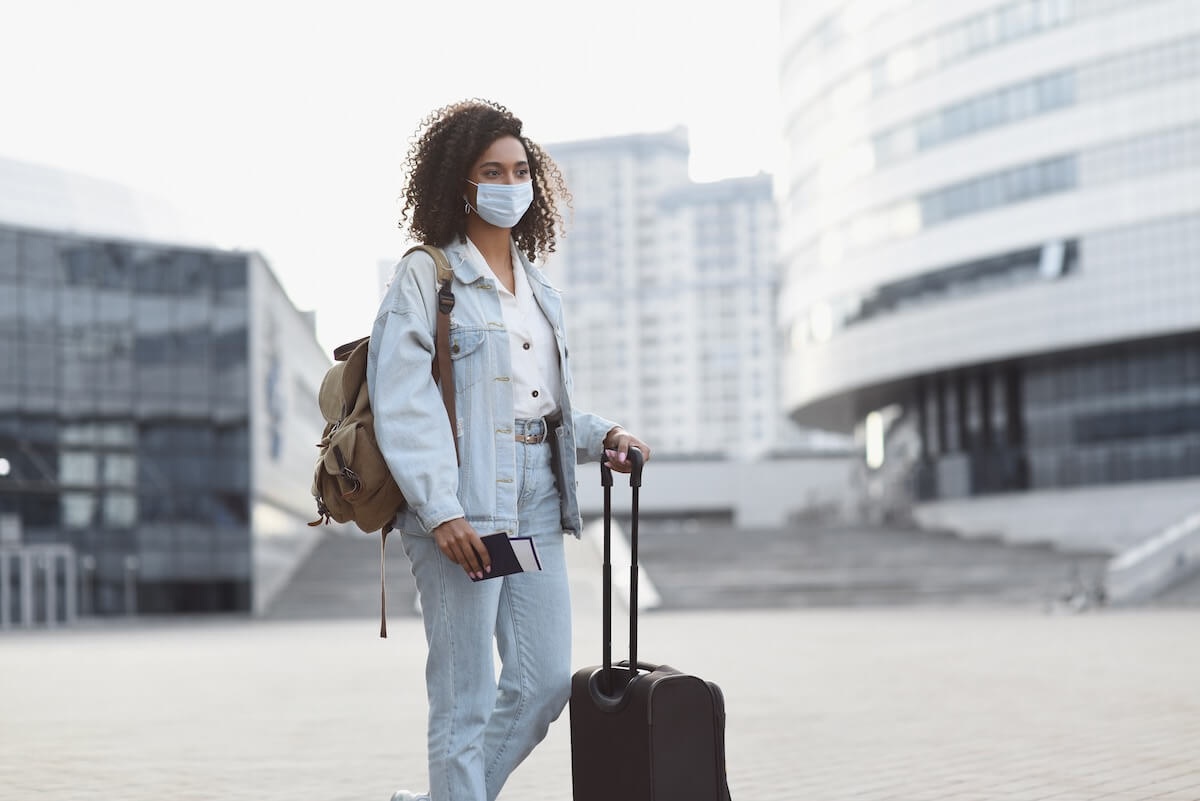 Girl traveling with a mask