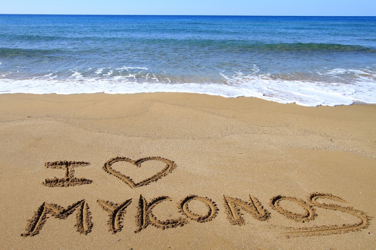 "I love Mykonos" written in the sand on the coast of Mykonos