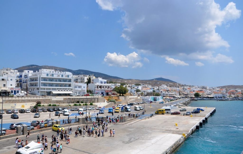 People and cars in new port in Mykonos