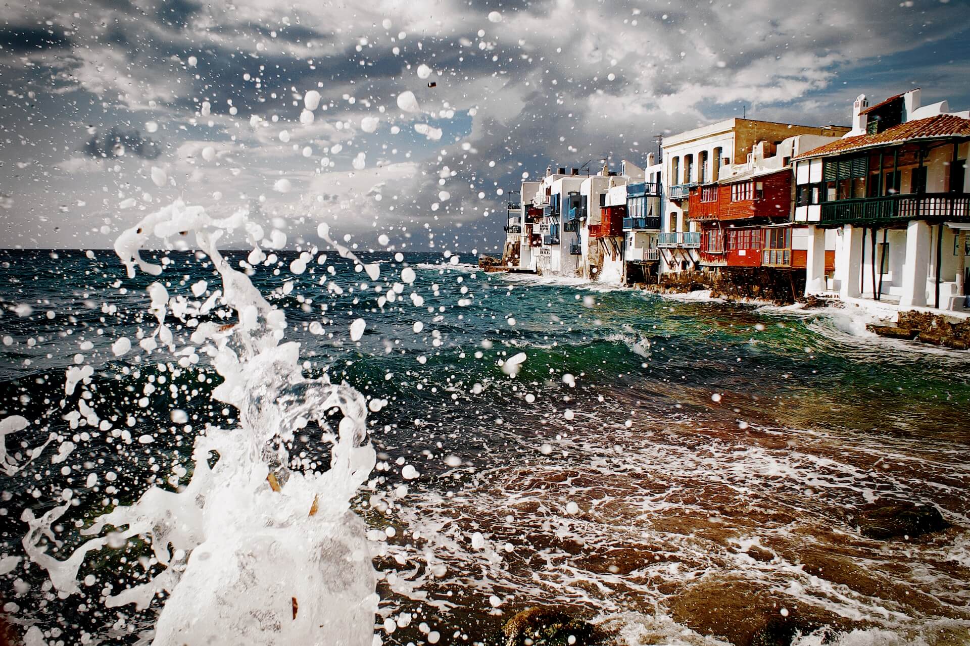 Waves on the coast of Little Venice in Mykonos town 