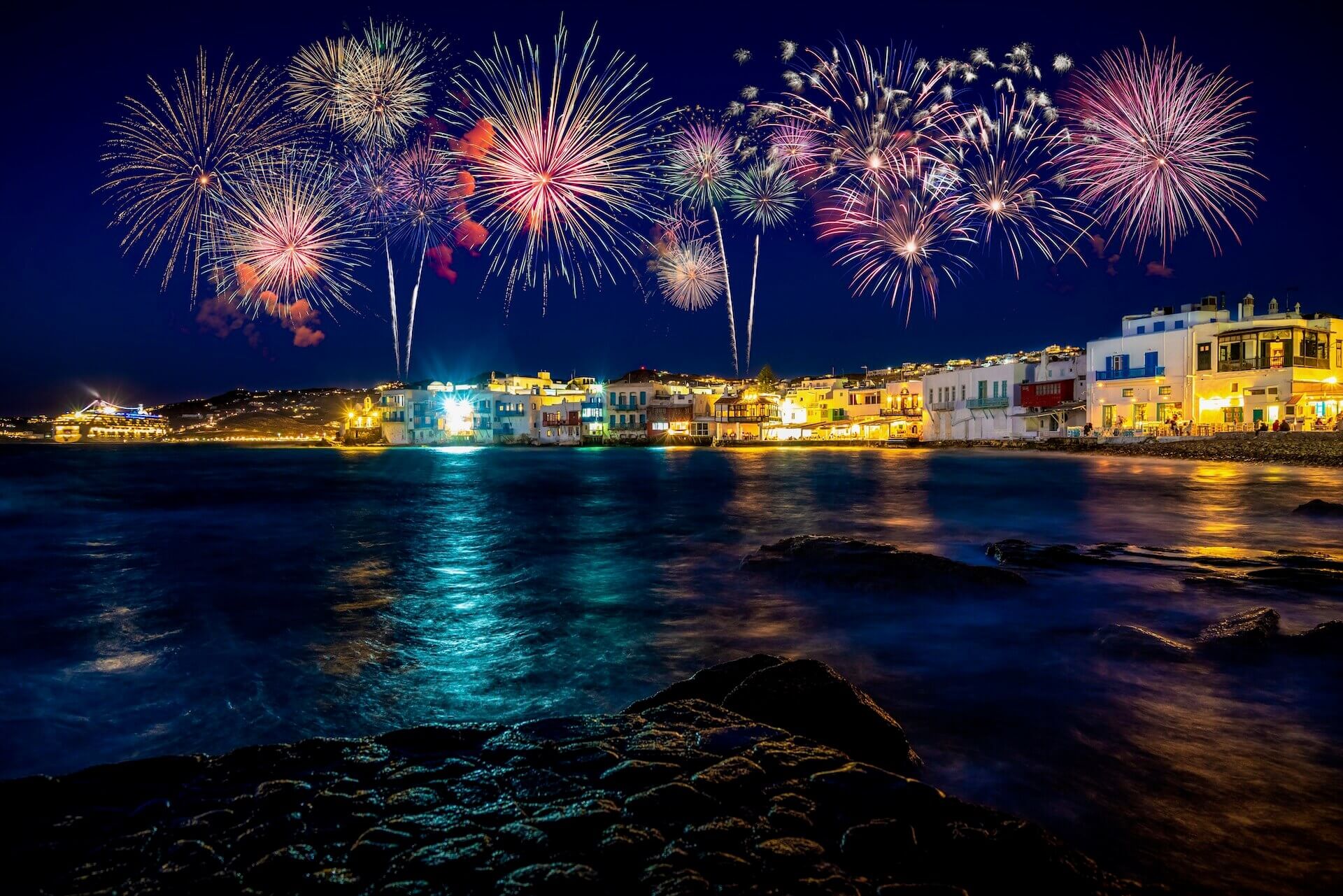 View of Mykonos at night and fireworks
