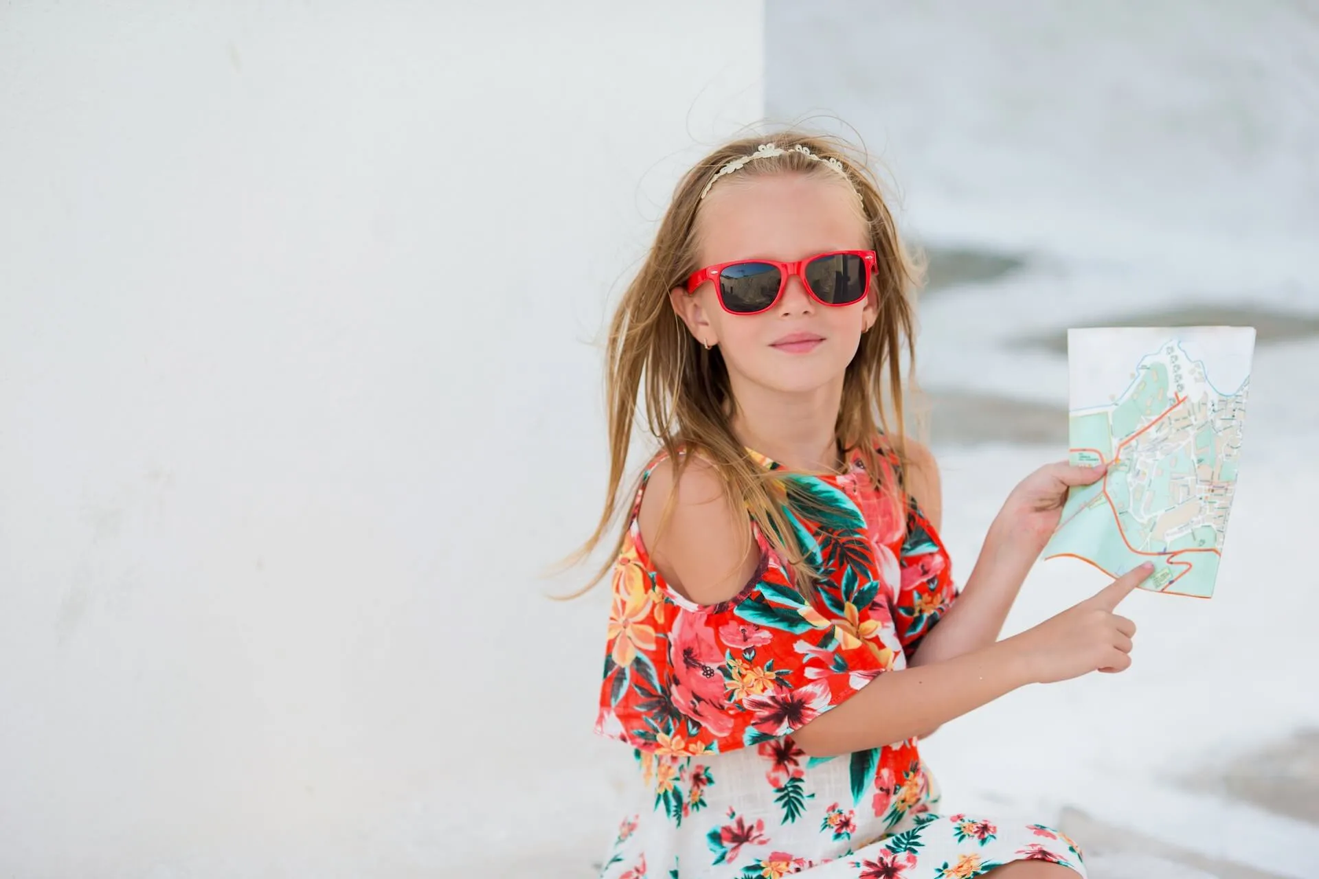 Girl showing a map