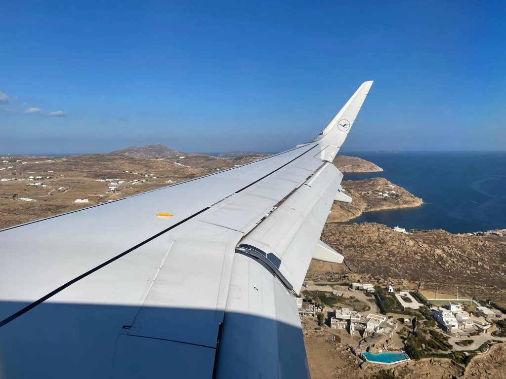 Wing of the plane flying over Mykonos
