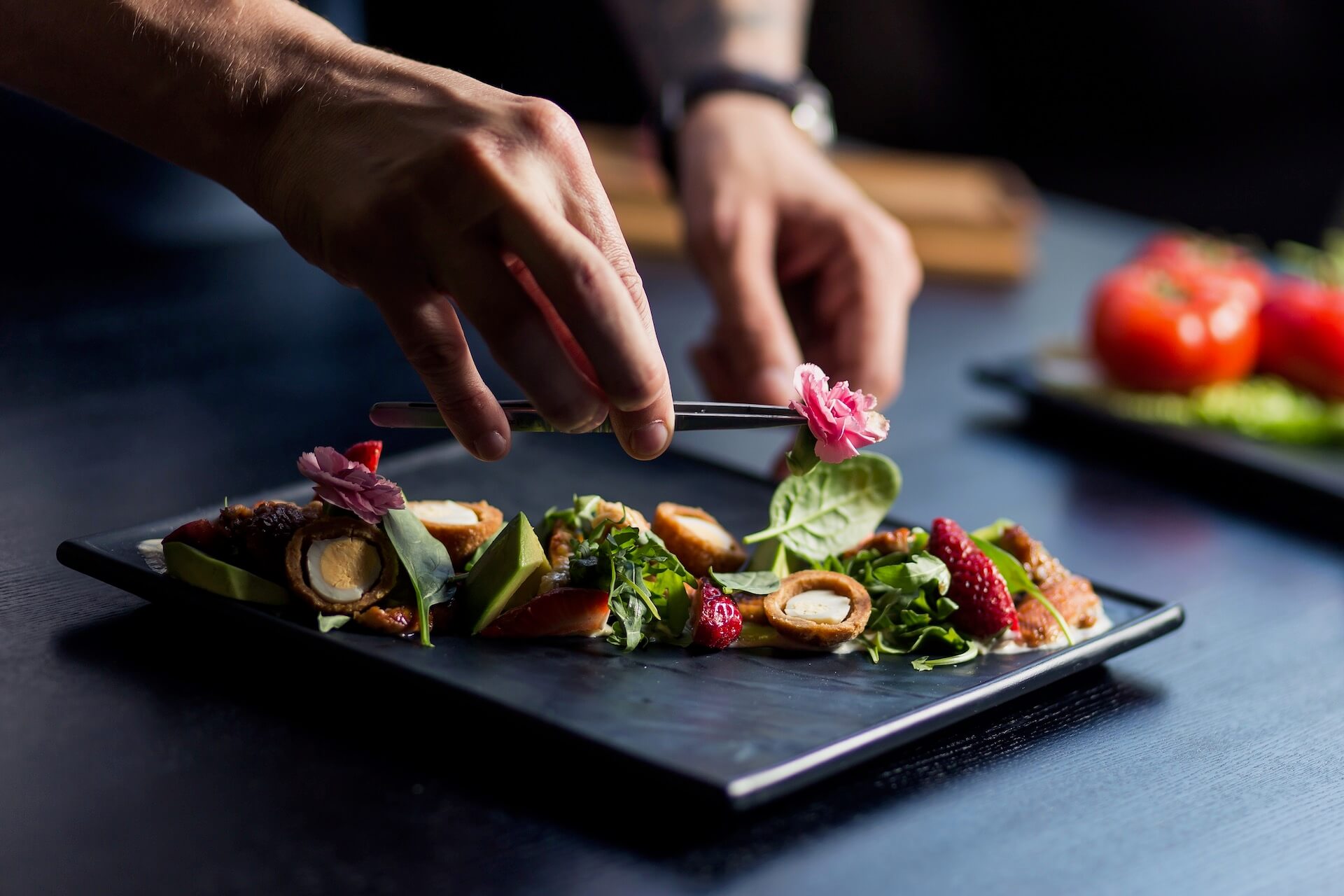 Professional chef decorating a plate 