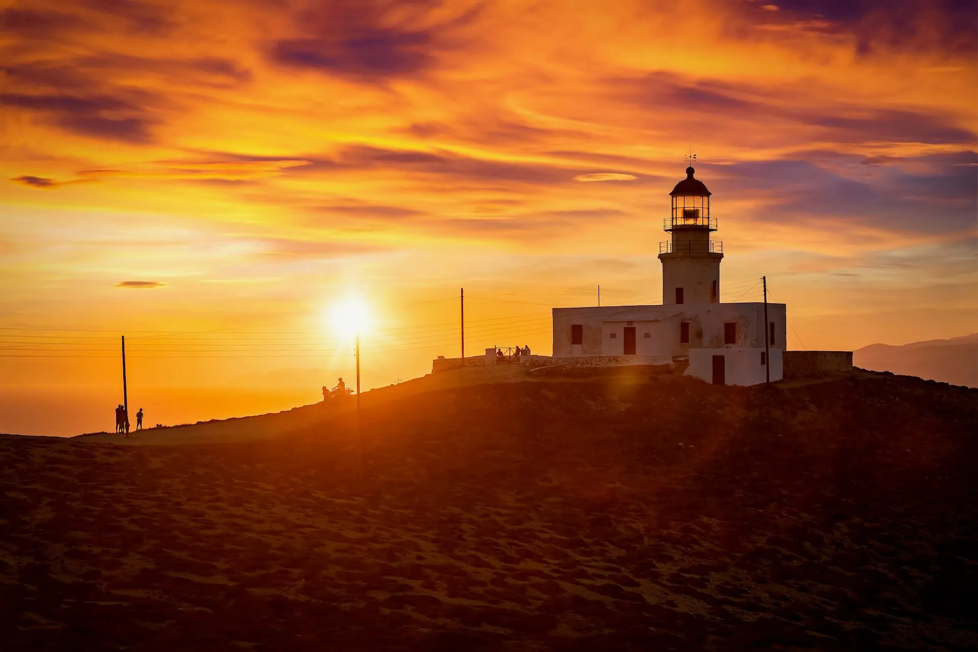 Armenistis Lighthouse in Mykonos at sunset 