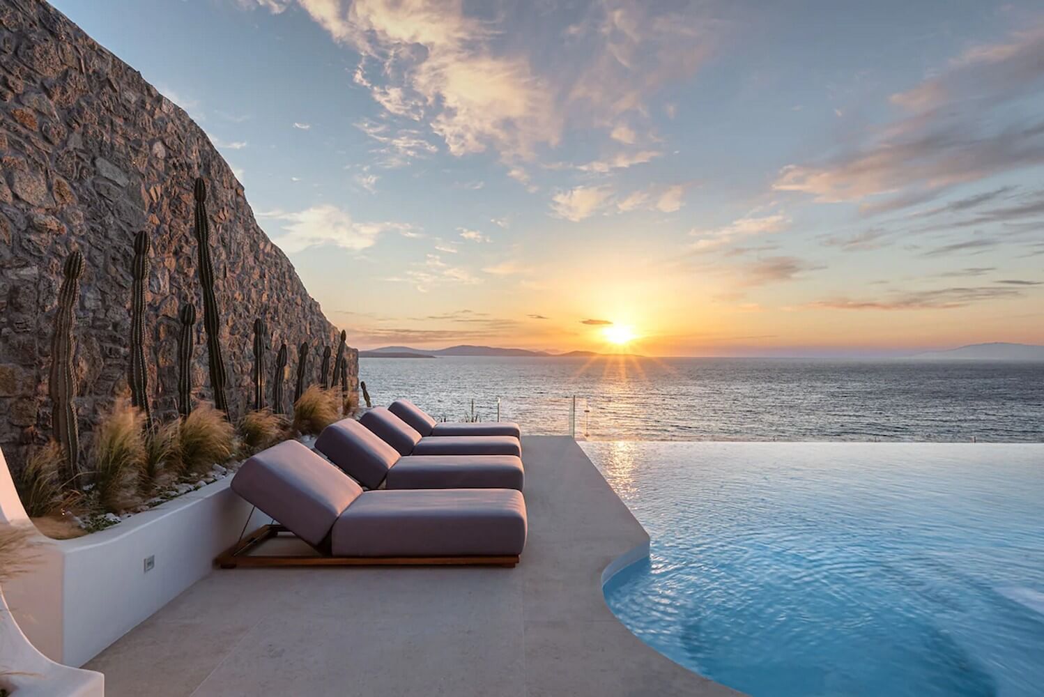 Infinity pool and sunbeds in a private Mykonos villa