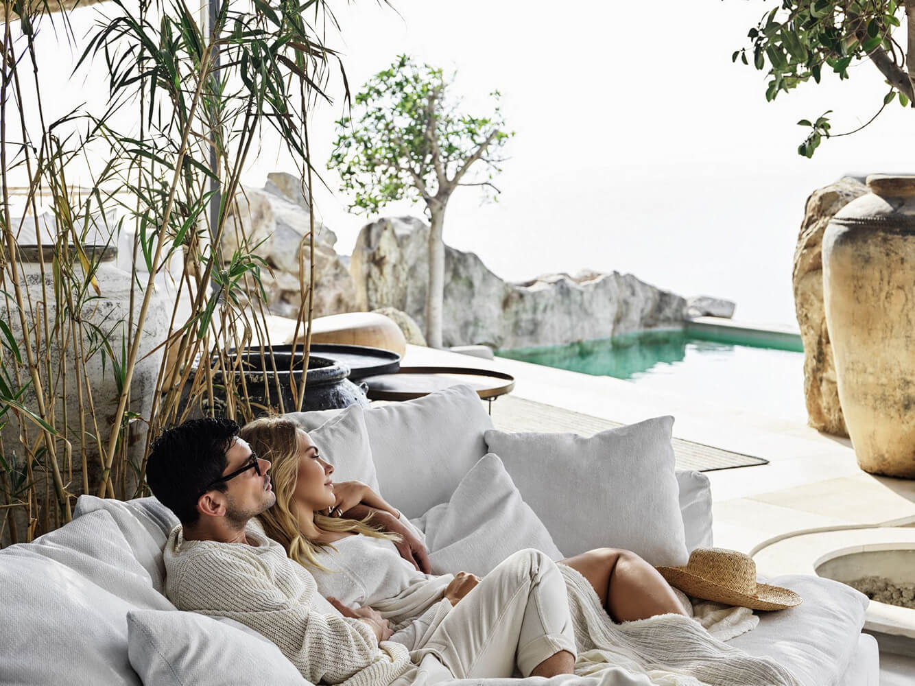 Couple lounging in a Mykonos villa