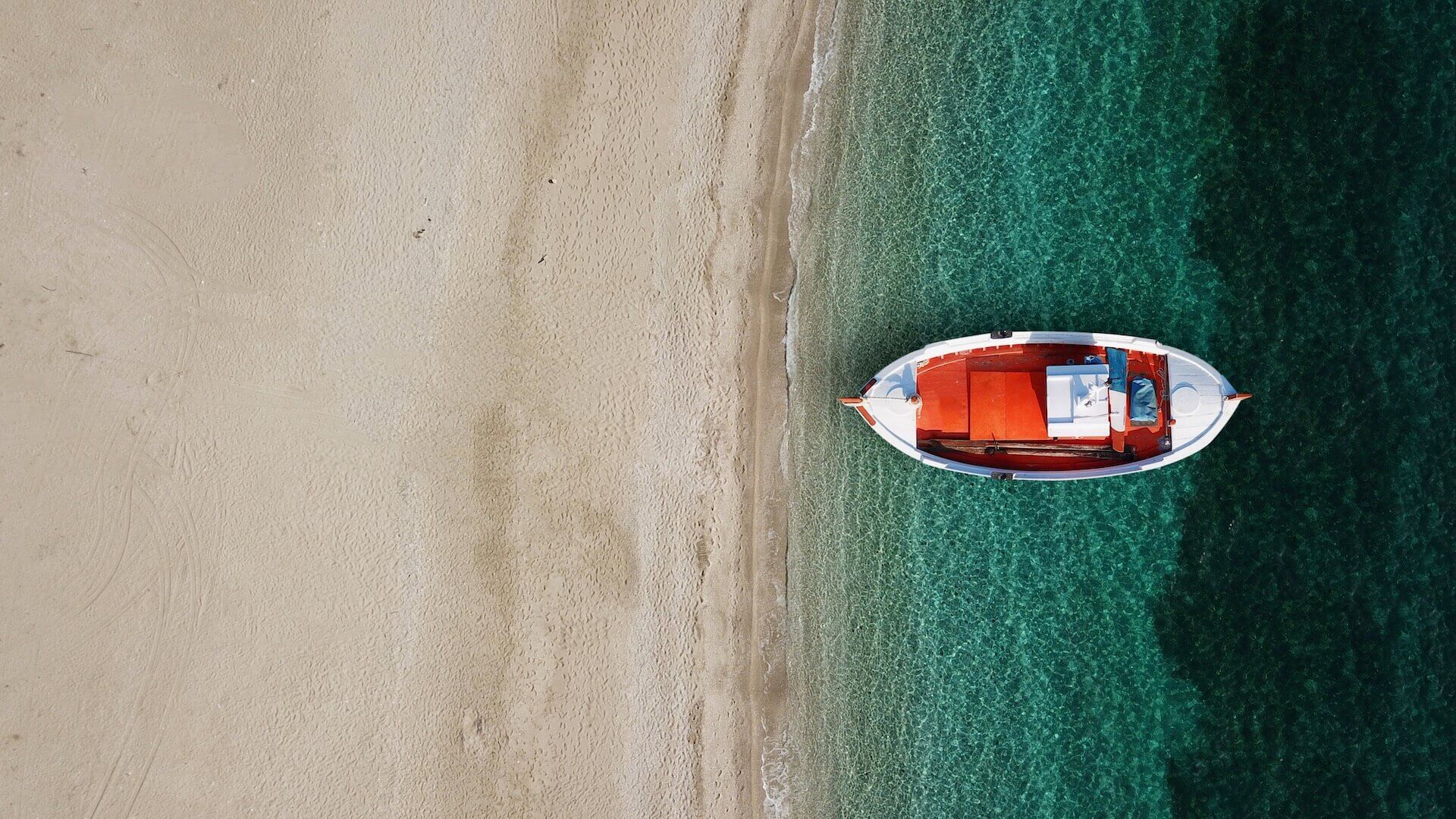 Boat on the Psarou Beach shoreline