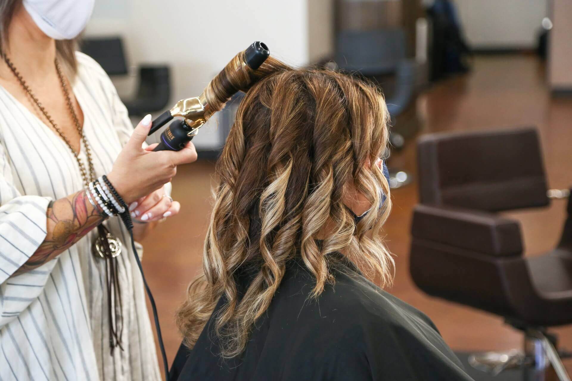 Girl getting her hair curled