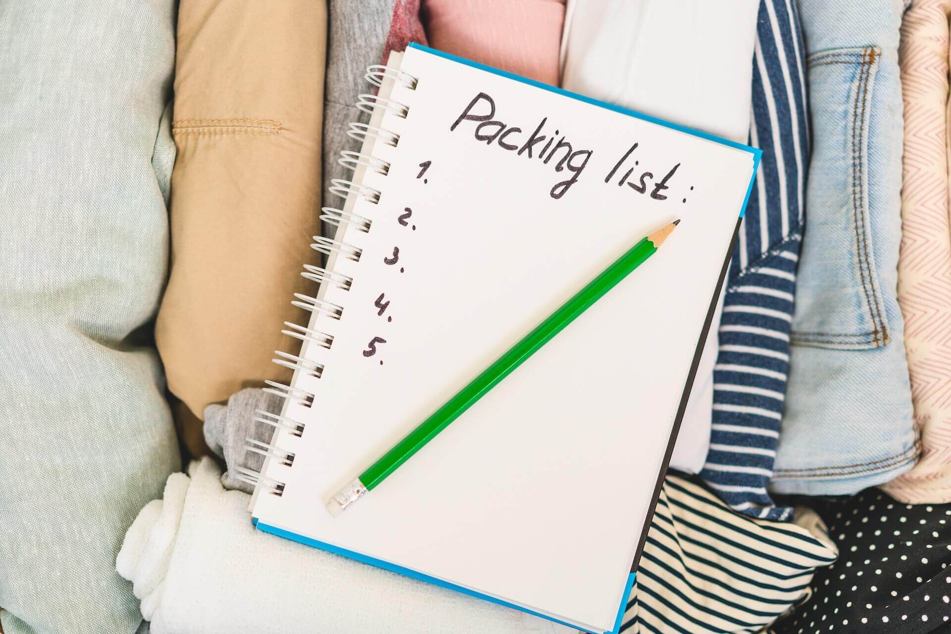 Packing list on the top of the rolled clothes