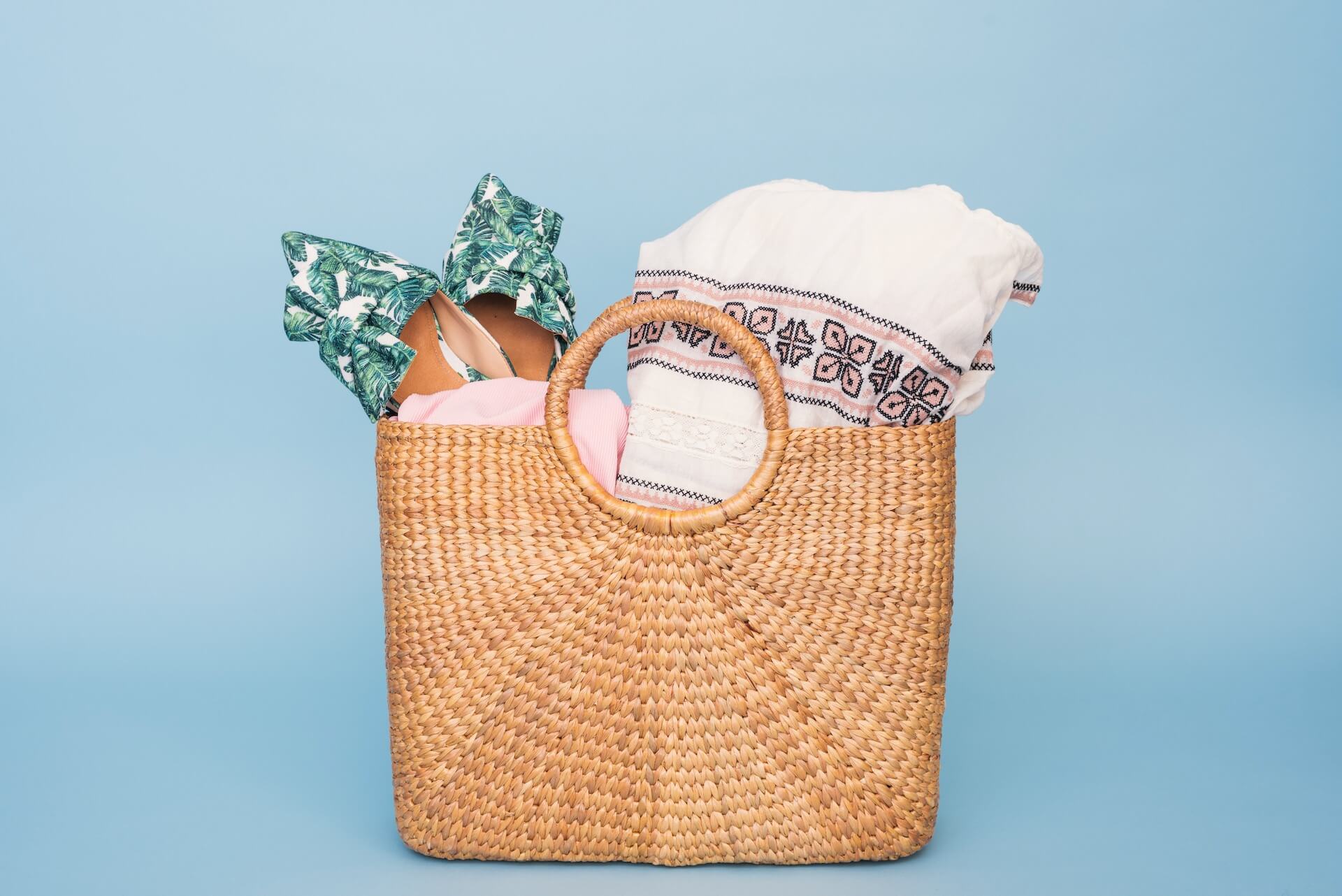  Towels and shoes in a beach basket