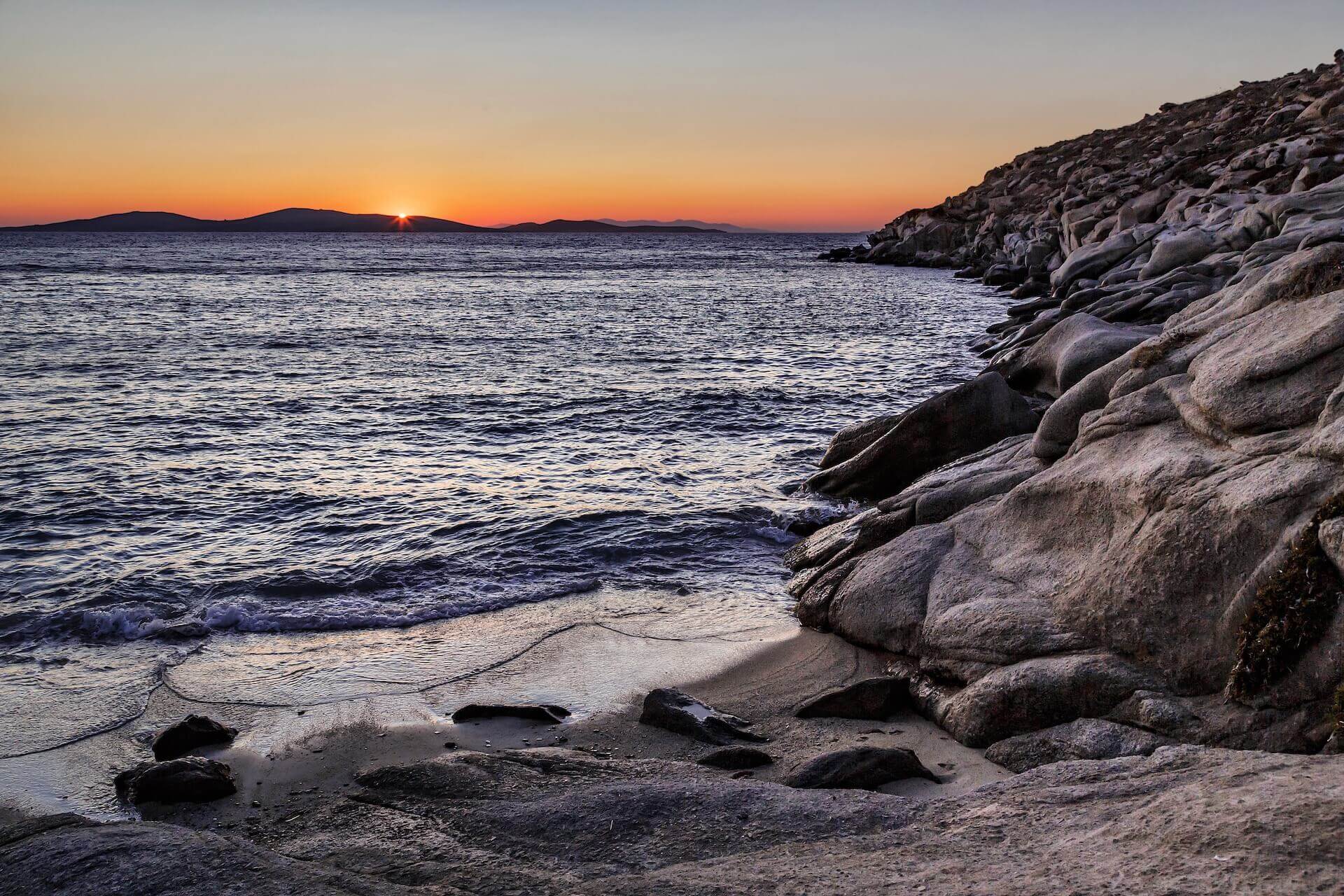View of a sunset from a beach in Mykonos 