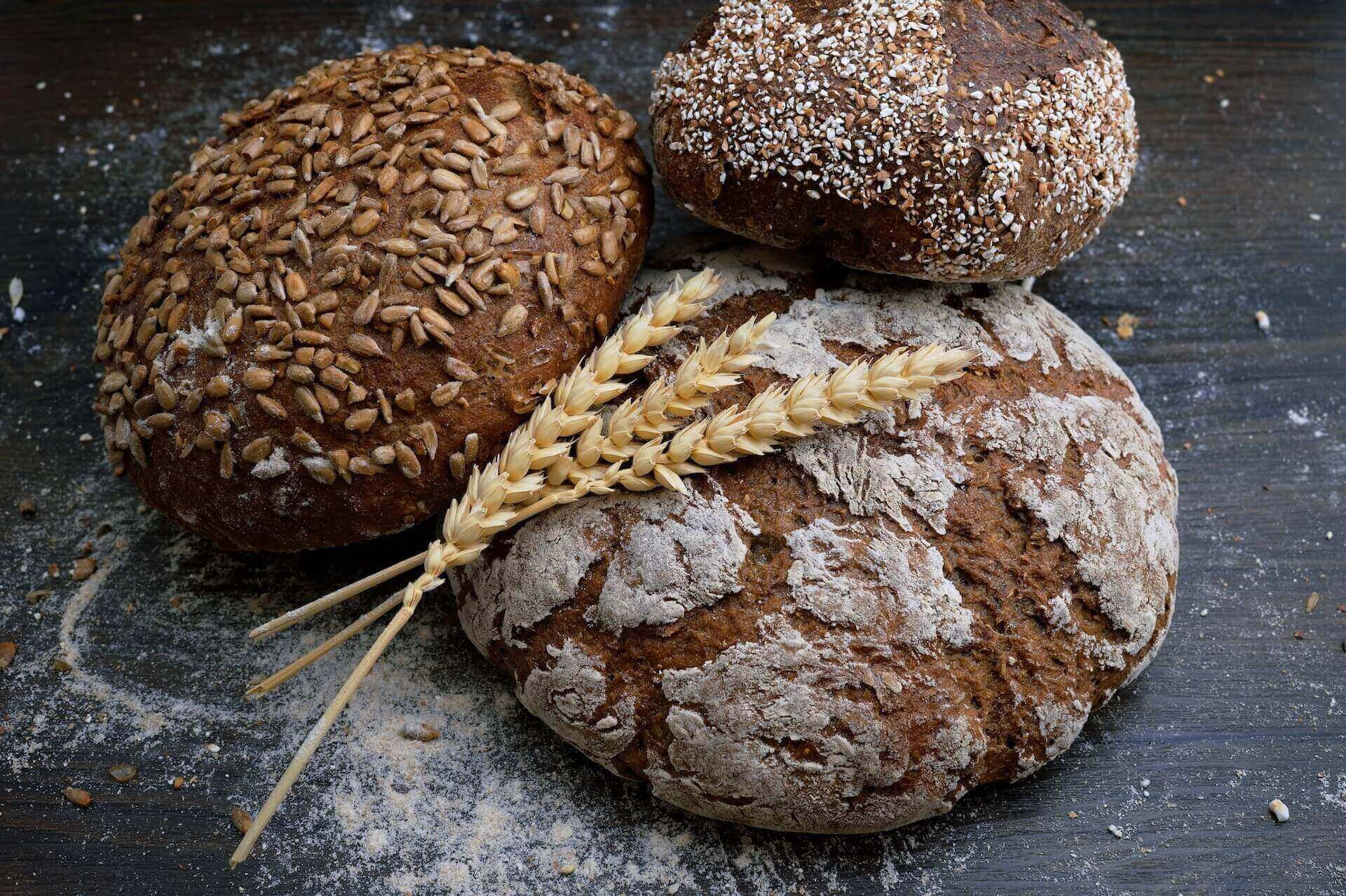 Three loaves and some wheat streaks on them