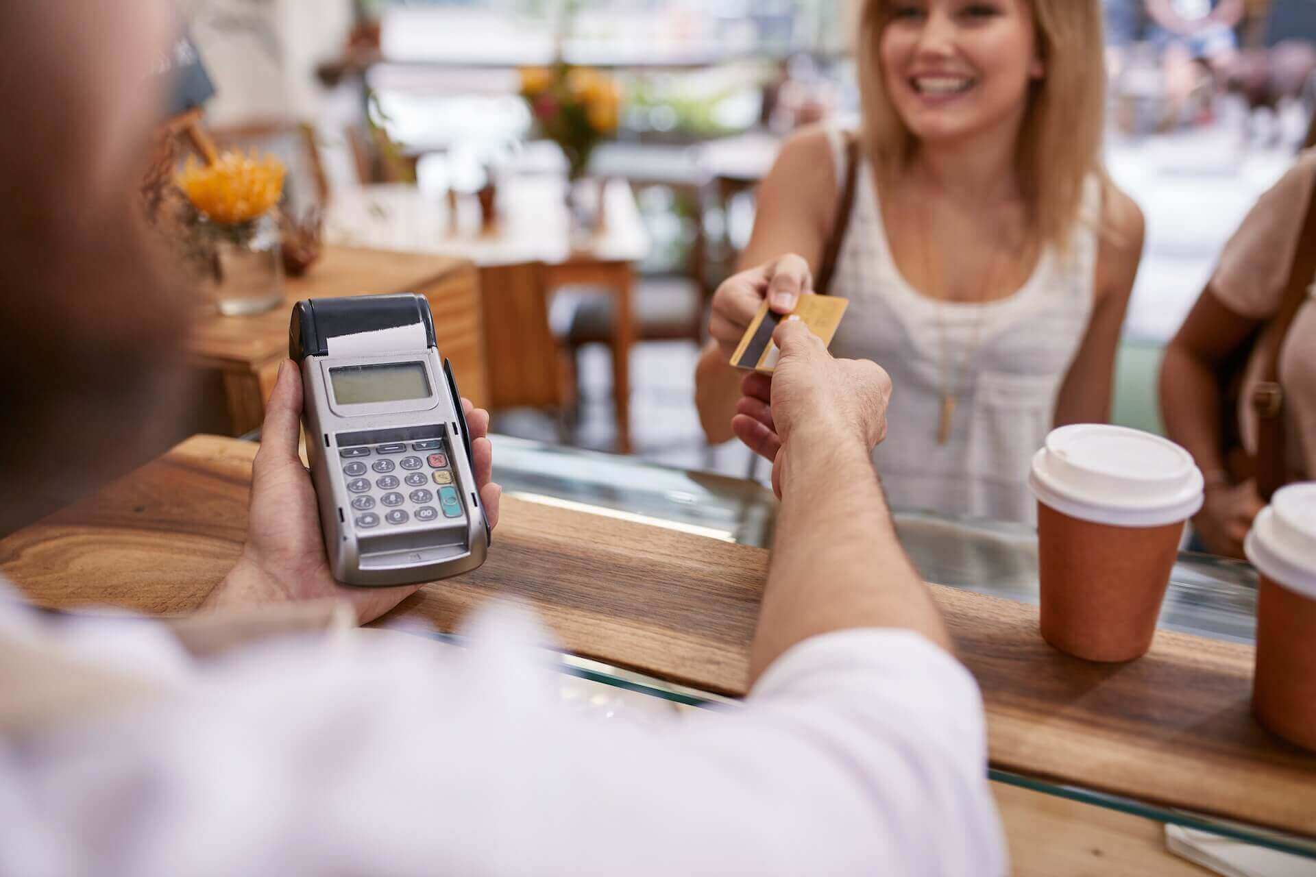 Woman paying with a card on Mykonos