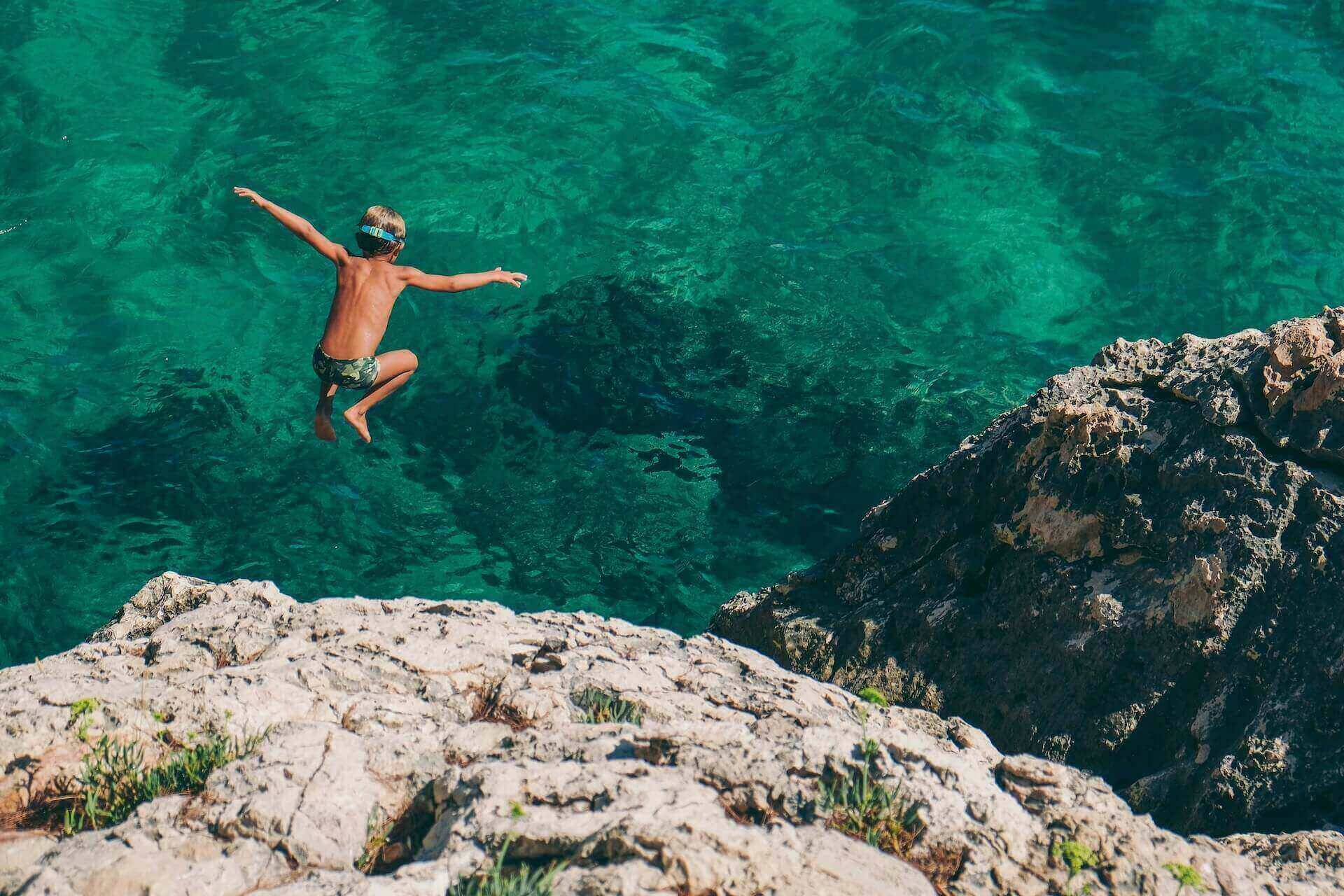 A boy in Greece, cliff diving
