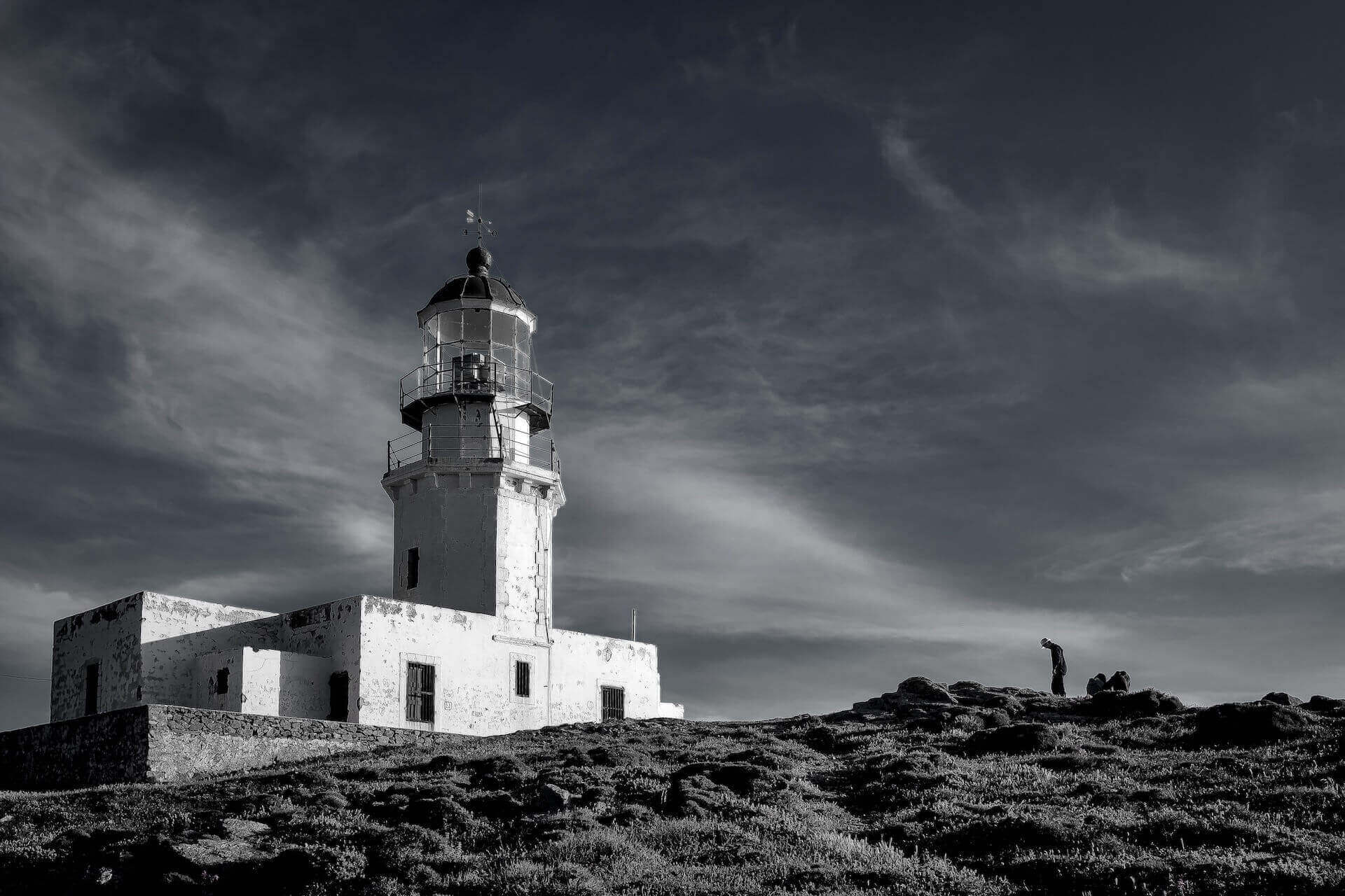 Black and white photo of Armenistis Lighthouse on the coast of Mykonos