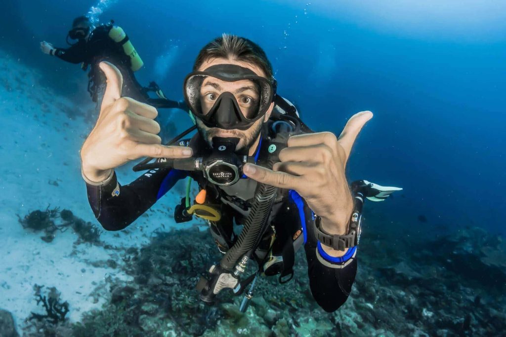 Guy scuba diving in Mykonos