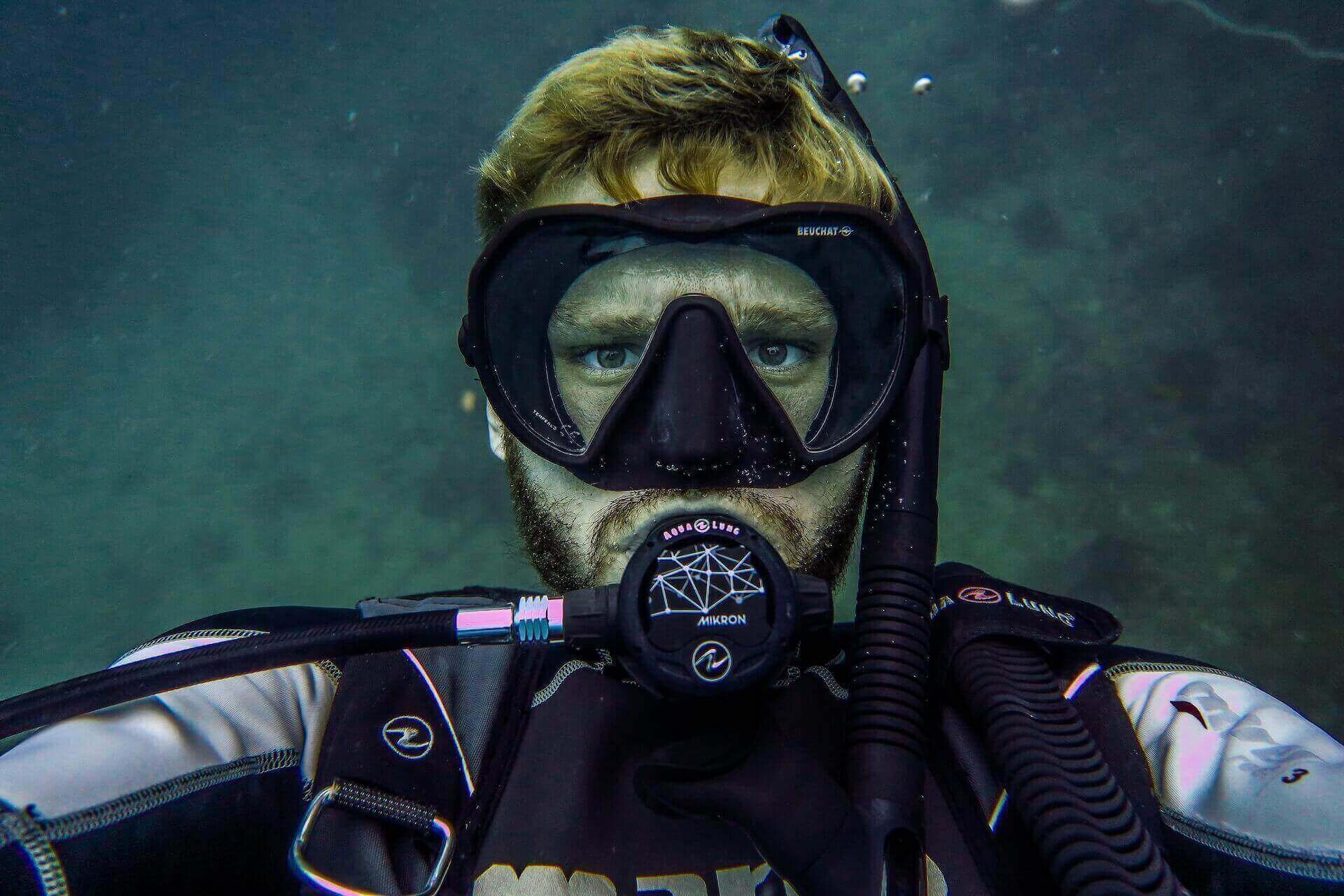  Person underwater with rented equipment