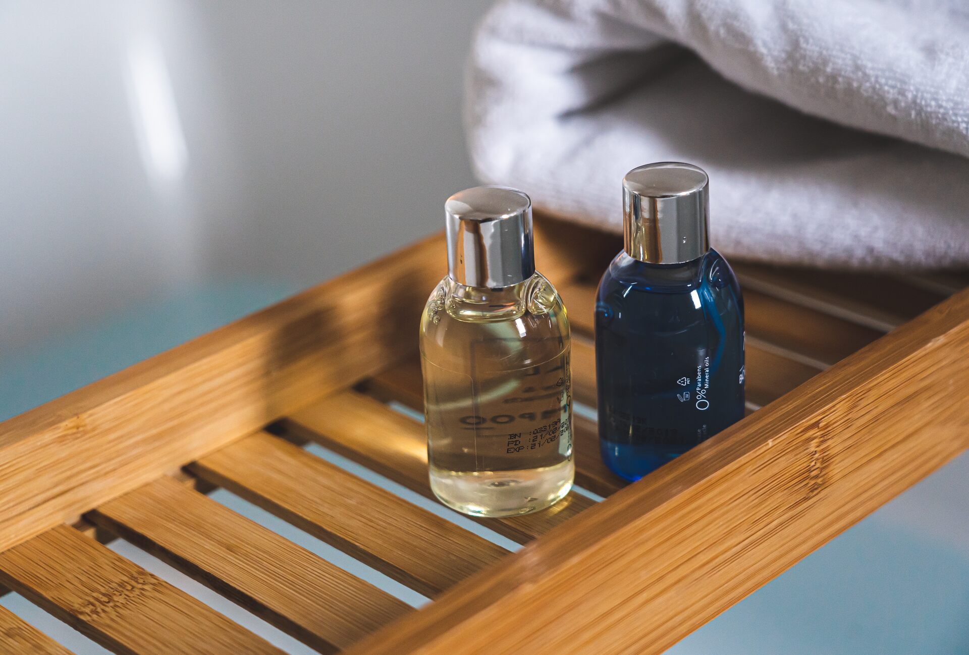 Clear bottles on a wooden tray