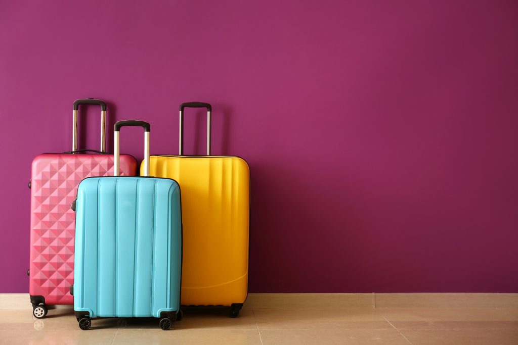 Three suitcases packed for a trip