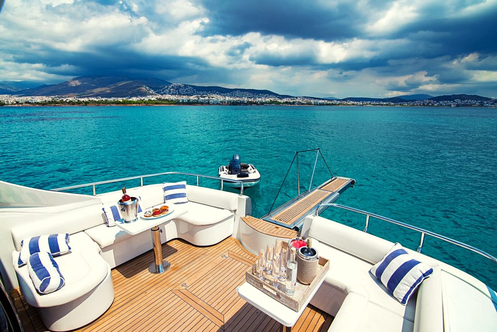 A luxurious yacht with a modern design and elegant furnishings, features a spacious sun deck and a jacuzzi, perfect for relaxing and enjoying the beautiful view of Mykonos Island and the Mediterranean sea. Concierge services are provided to ensure a comfortable and enjoyable sailing experience.