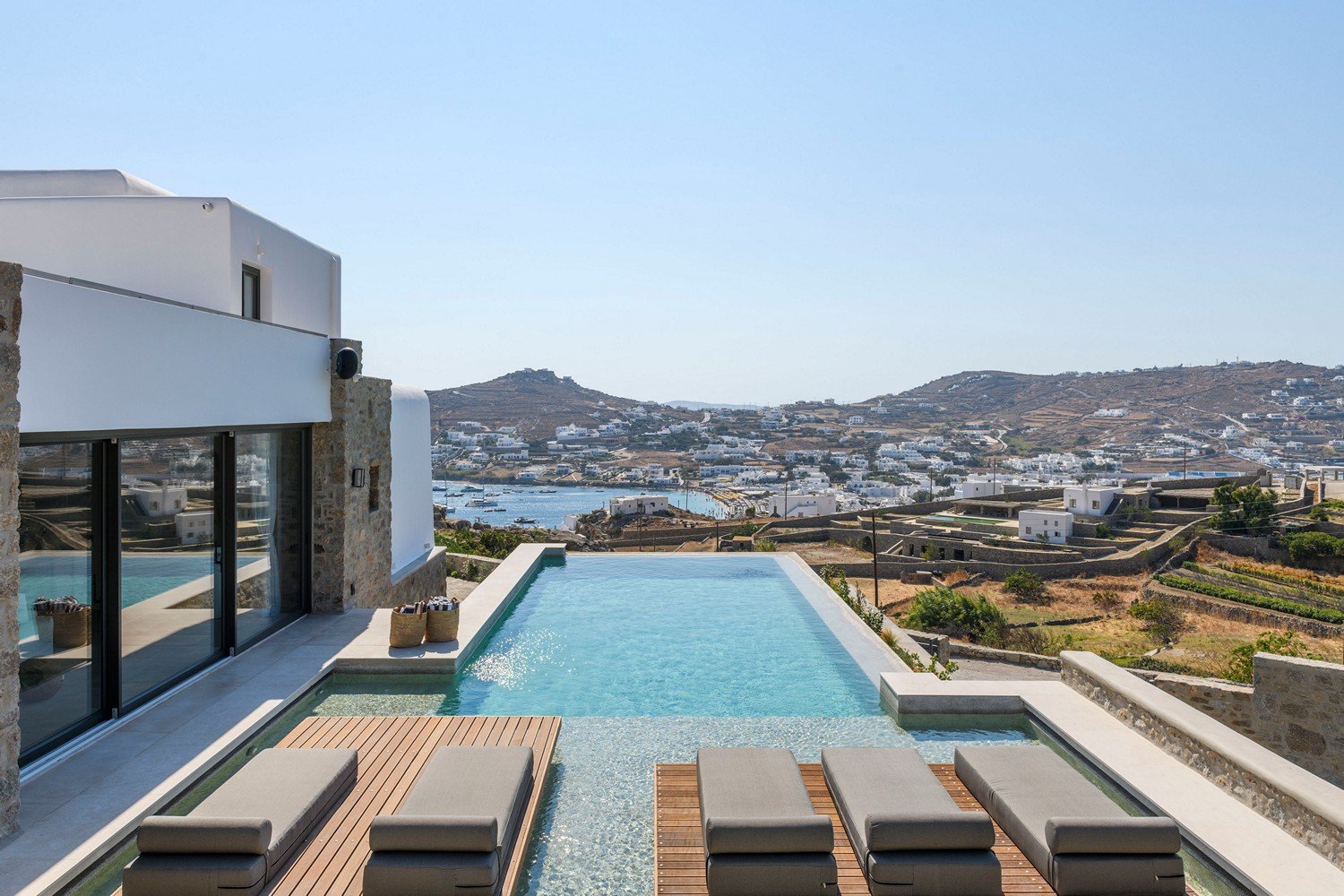 Sunbeds in front of a pool