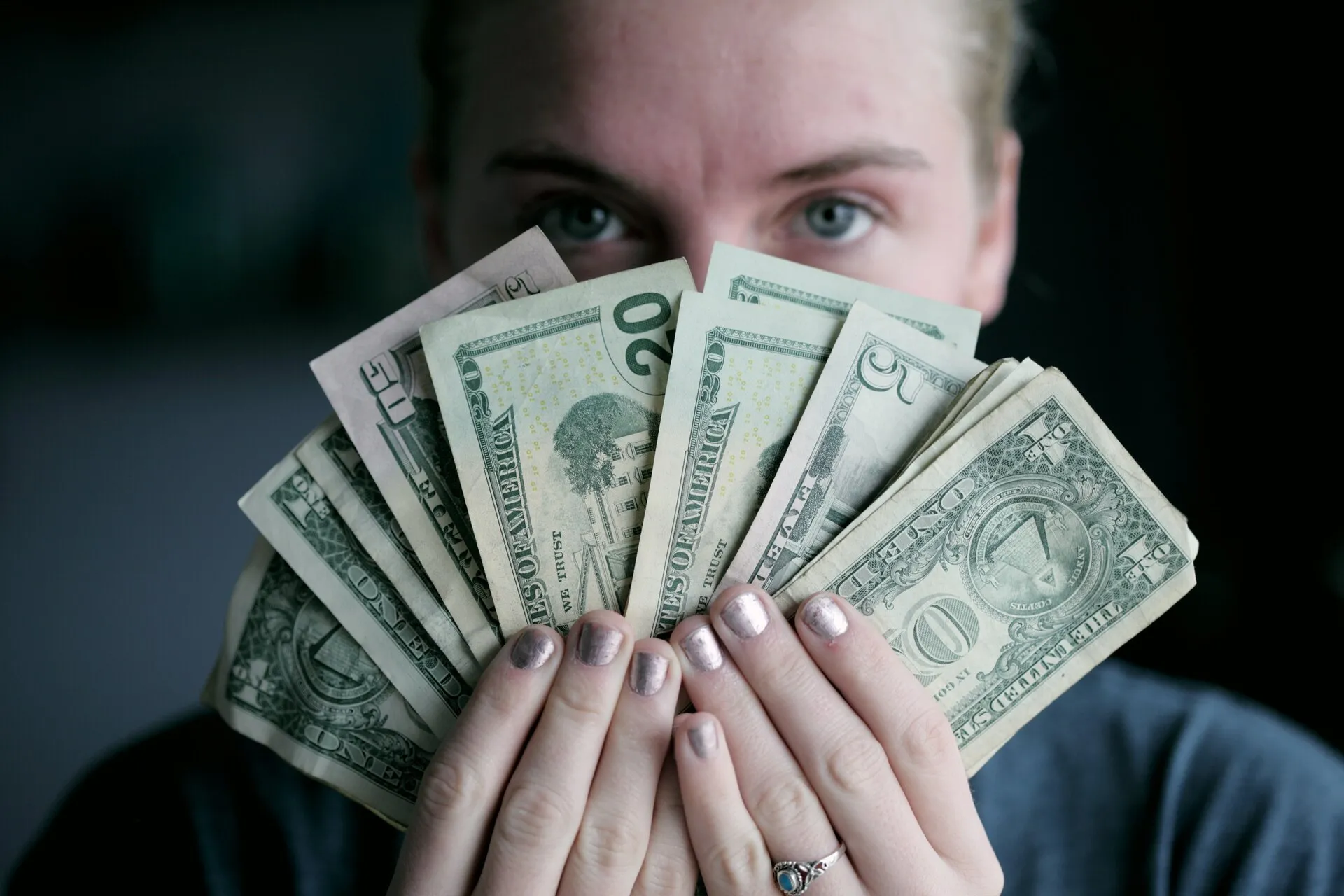 A woman holding money