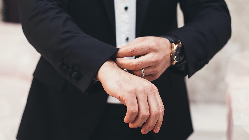 A man fixing his suit
