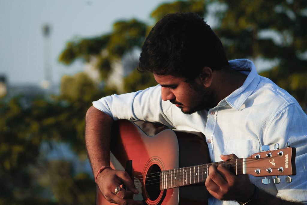 A man playing the guitar