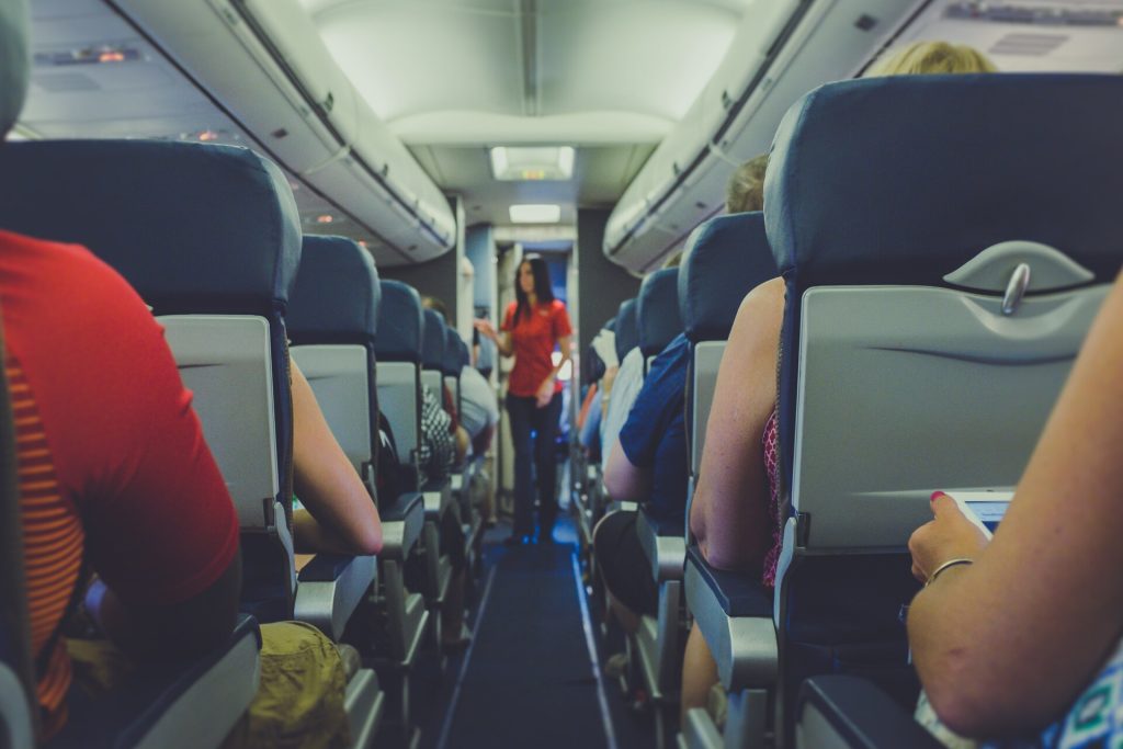 Flight attendants and people in a plane