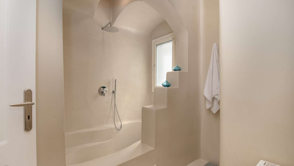 Spacious bathroom and a shower in Mykonos exceptional villa for rent.
