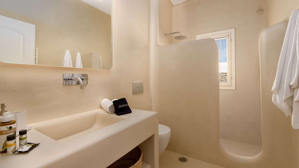 Creamy shades of walls and bath in Mykonos lavish villa for rent.