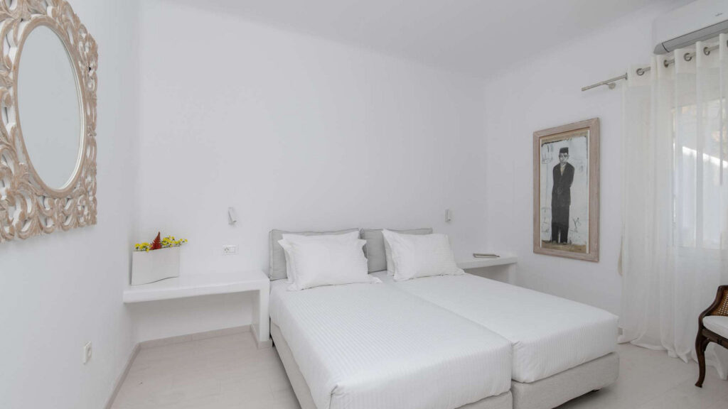Two comfortable beds in a modern bedroom in a top vacation rental home, Mykonos.